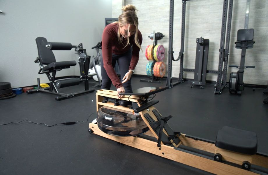 Woman folding down monitor arm on Ergatt Lite